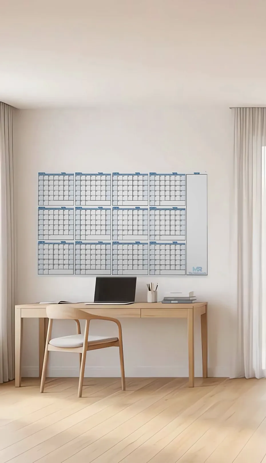 The Masterroute large dry erase wall calendar above a wooden desk in a bright modern home office
